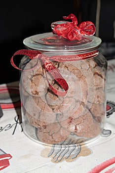 Delicious homemade cacao christmas cookies in a handmade decorated jar