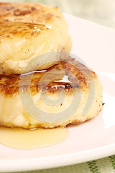 Delicious homemade cheese pancakes with honey