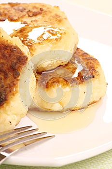 Delicious homemade cheese pancakes with honey