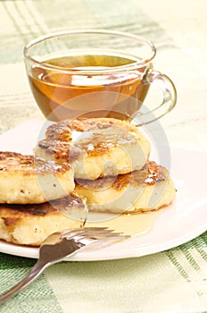 Delicious homemade cheese pancakes with honey