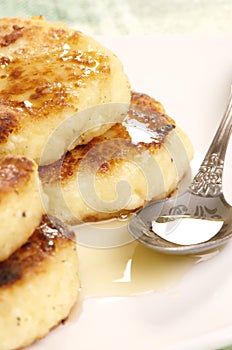 Delicious homemade cheese pancakes with honey