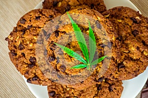 Delicious homemade Cookies with CBD cannabis and leaf garnish an