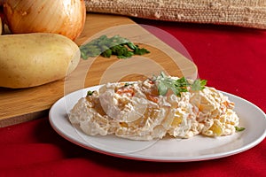 A delicious homemade creamy potato salad served on a white plate