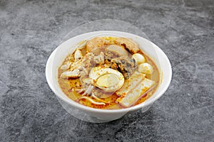 Delicious homemade curry noodles  mee kari  serve with seafood and egg