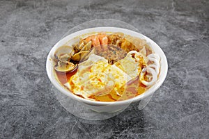 Delicious homemade curry noodles  mee kari  serve with seafood and egg