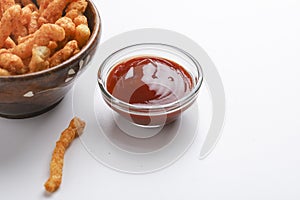 Delicious Homemade kurkure snack with tomato ketchup on white background