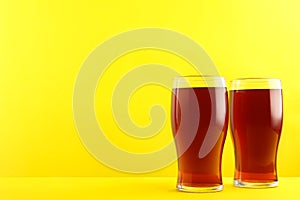 Delicious homemade kvass in glasses on background. Space for text