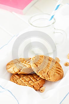 Delicious homemade peanut butter cookies with mug of milk.