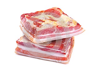 Delicious homemade raw-smoked, cured bacon, lard, isolated on a white background photo