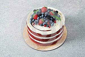 Delicious homemade red velvet cake with fresh berries