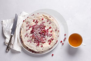 Delicious homemade tart with red currants and meringue, decorated with fresh berries, sprinkled with powdered sugar