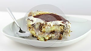 Delicious homemade tiramisu cake traditional Italian dessert on white background, dolly camera movement, nutrition health-care