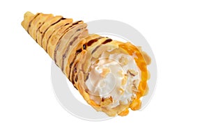 Delicious honeyed waffles, twisted into cones with cream, nuts, chocolate topping isolated