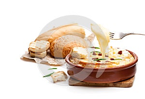 Delicious hot baked camembert with sultanas isolated on white