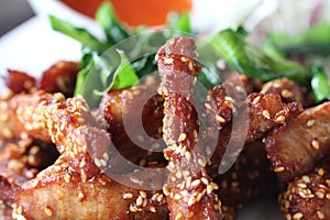 Delicious hot Deep Fried chicken pork stick topping with  sesame decorated with fried herb at gourmet restaurant