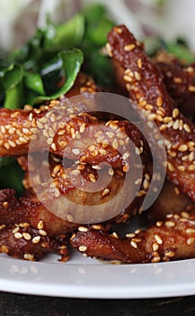 Delicious hot Deep Fried chicken pork stick topping with  sesame decorated with fried herb at gourmet restaurant