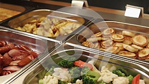 Delicious hot meals are on a buffet lunch in a hotel, top panorama