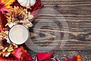 Hot Cup of Steaming Coffee with Autumn Leaves and Flowers