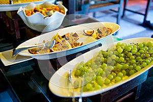 Delicious hotel restaurant allinclusive buffet with tasty food. Fruit papaya, pineapple