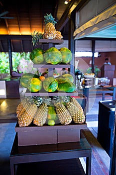 Delicious hotel restaurant allinclusive buffet with tasty food. Fruit papaya, pineapple photo