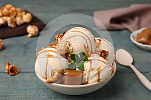 Delicious ice cream with caramel, popcorn and sauce