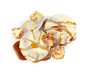 Delicious ice cream with caramel popcorn and sauce on white background