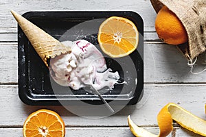 Delicious ice cream and oranges