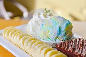 Delicious ice rainbow, brownie, cake, vanilla cream and banana in holiday,select focus