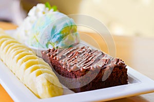 Delicious ice rainbow, brownie, cake, vanilla cream and banana in holiday,select focus