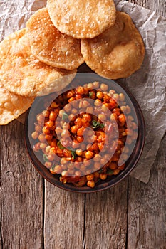 Delicious Indian Chana masala and puri. Vertical top view