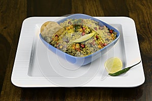 Delicious Indian chat dish, BHEL pur served in blue bowl photo