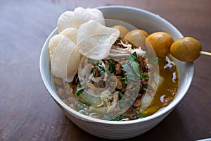 Delicious indonesian food of bubur ayam with traditional side dishes