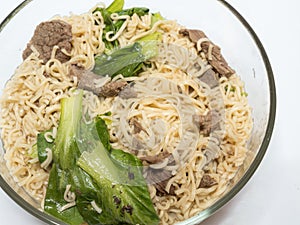 Delicious instant noodle in bowl on white