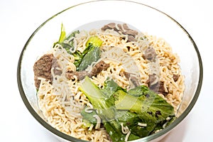 delicious instant noodle in bowl on white background