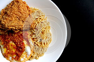 Delicious Instant Noodle with Crispy Chicken and Fried Egg