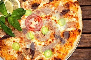 Delicious italian pizza served on wooden table