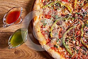 Delicious italian pizza served on wooden table. top view, close up