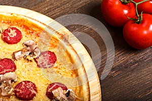 Delicious italian pizzas served on wooden table