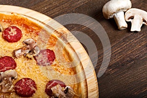 Delicious italian pizzas served on wooden table