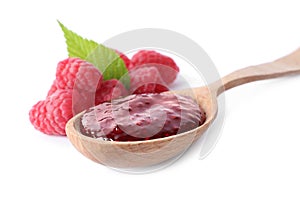 Delicious jam and fresh raspberries in spoon on white background