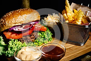 delicious juicy beef burger, american style food with french fries and coleslaw salad