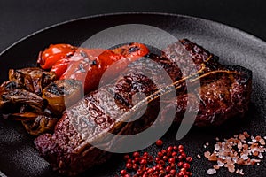 Delicious juicy beef tbone steak with salt, spices and herbs