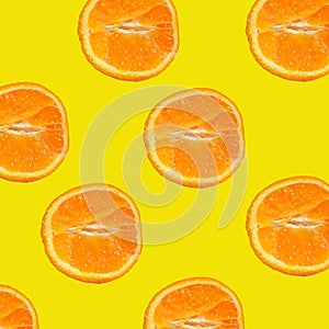 Delicious juicy oranges. Cut in half. Yellow background.