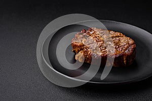 Delicious juicy pork or beef steak grilled with salt, spices and herbs