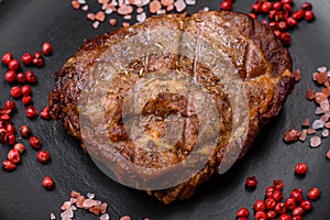 Delicious juicy pork or beef steak grilled with salt, spices and herbs