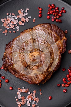 Delicious juicy pork or beef steak grilled with salt, spices and herbs