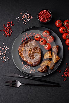 Delicious juicy pork or beef steak grilled with salt, spices and herbs