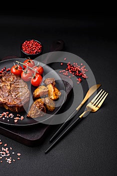 Delicious juicy pork or beef steak grilled with salt, spices and herbs