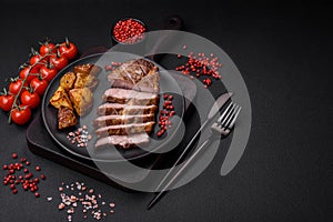 Delicious juicy pork or beef steak grilled with salt, spices and herbs