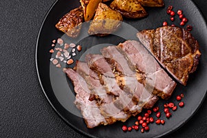 Delicious juicy pork or beef steak grilled with salt, spices and herbs